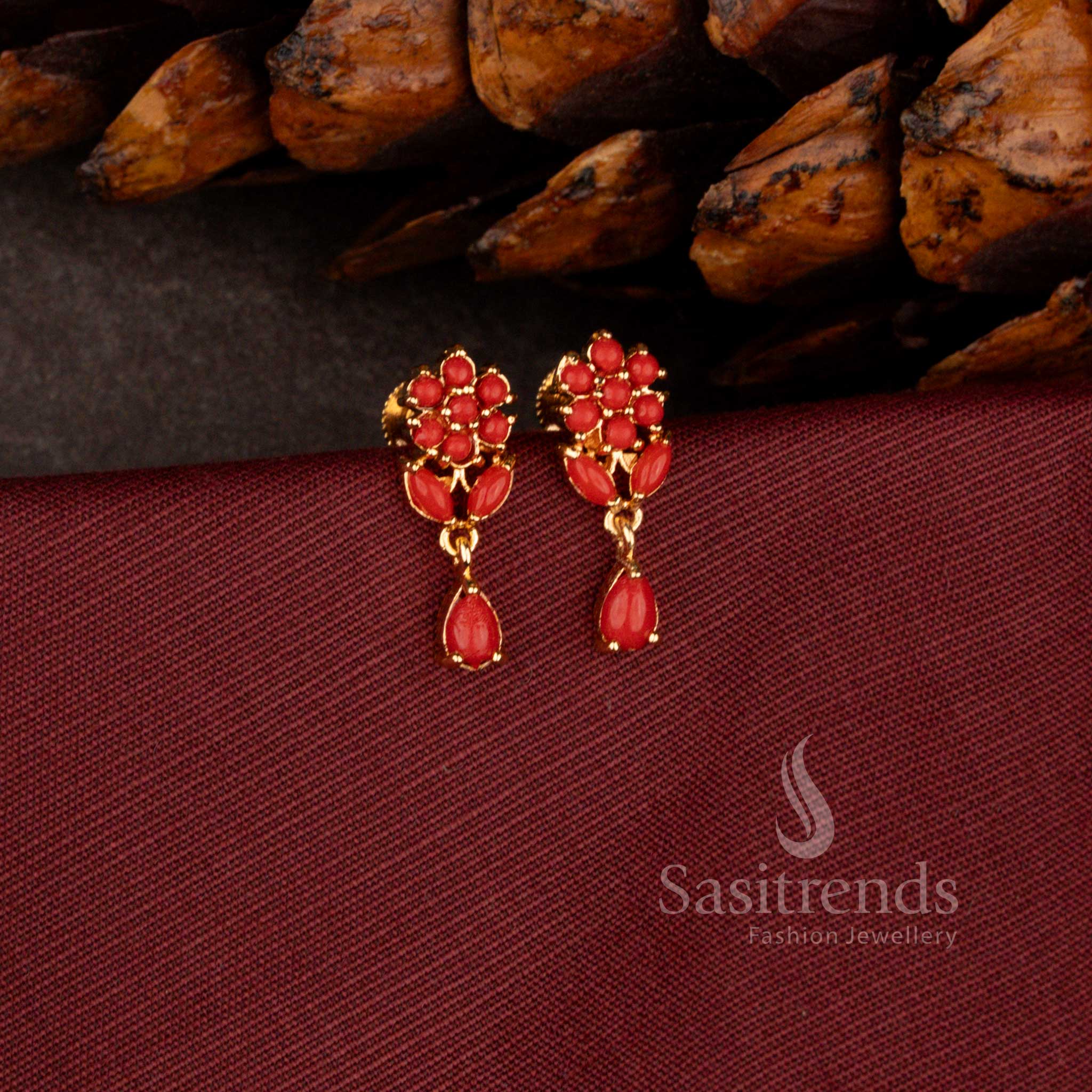 Sasitrends premium micro gold plated dangler earrings adorned with a brilliant teardrop AD stone stud and rich polished finish perfect for bridal and grand celebration wear.