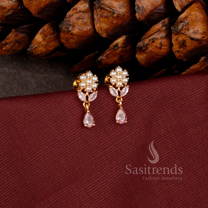 Sasitrends premium micro gold plated dangler earrings adorned with a brilliant teardrop AD stone stud and rich polished finish perfect for bridal and grand celebration wear.