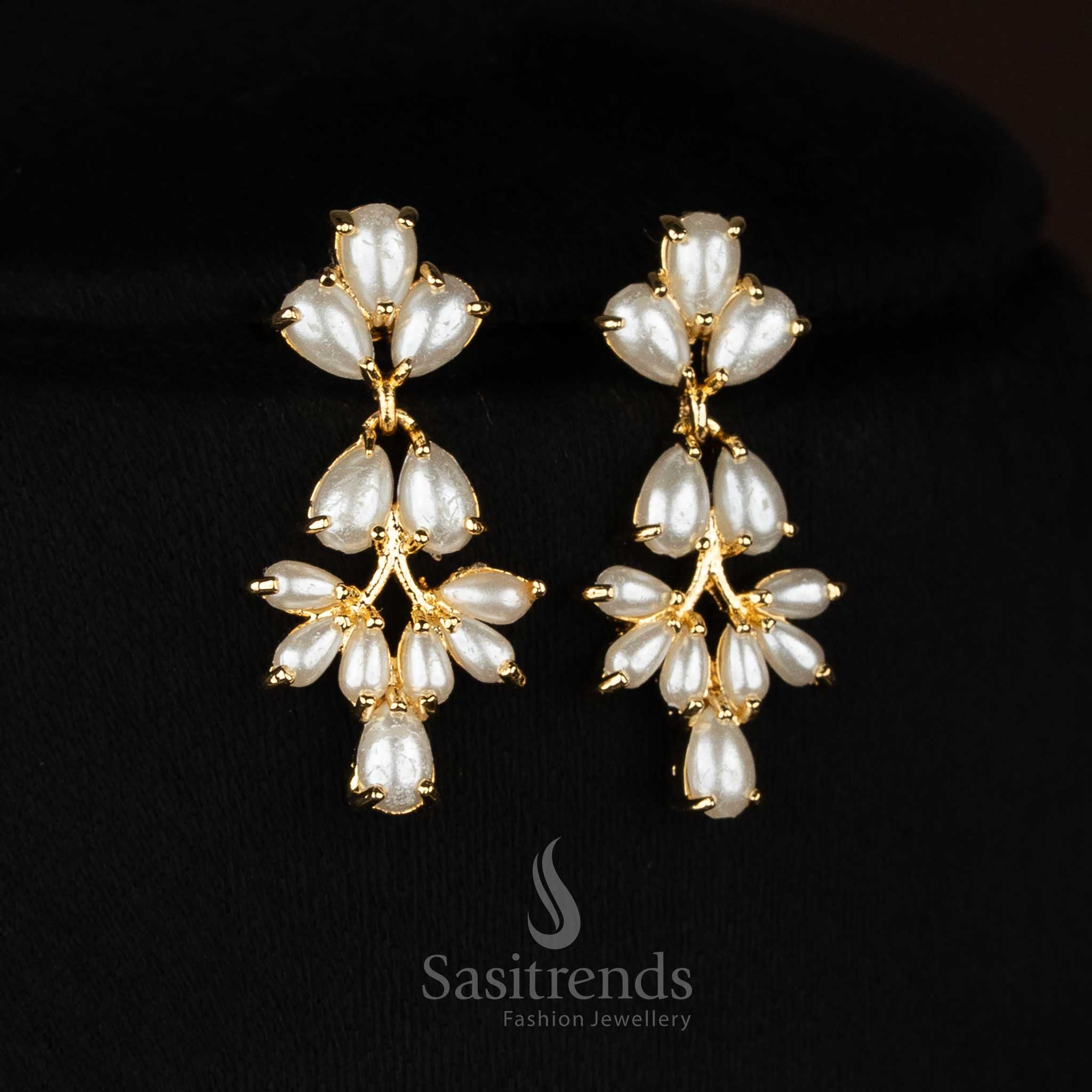 Party wear micro gold plated american diamond pearl floral link ruby green necklace set by Sasitrends