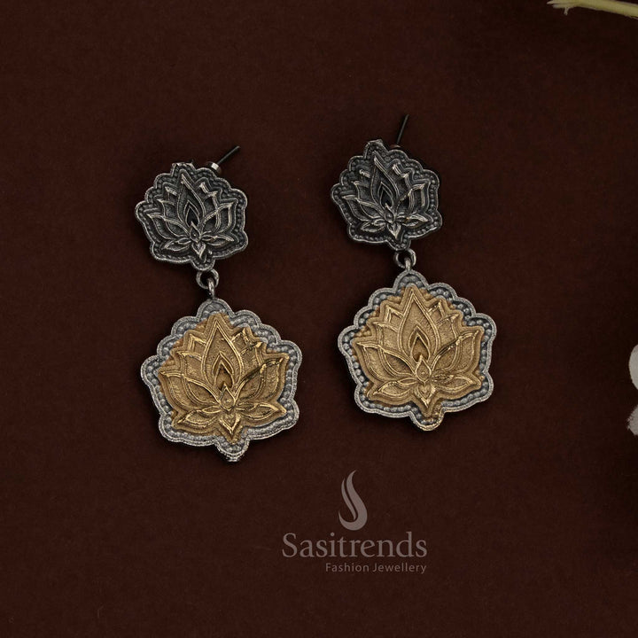Majestic in presence, this 92.5 dual tone silver oxidised plated lotus pendant choker husli necklace set is crafted to create a powerful ethnic jewellery statement through symbolic detailing and structured artistry - Sasitrends
