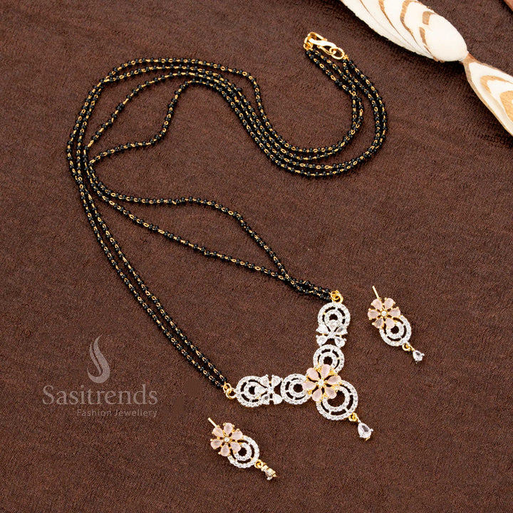Dazzling pink floral motif pendant set with American Diamonds, designed with a Mangalsutra chain and matching earrings, a classic and elegant jewellery masterpiece - Sasitrends