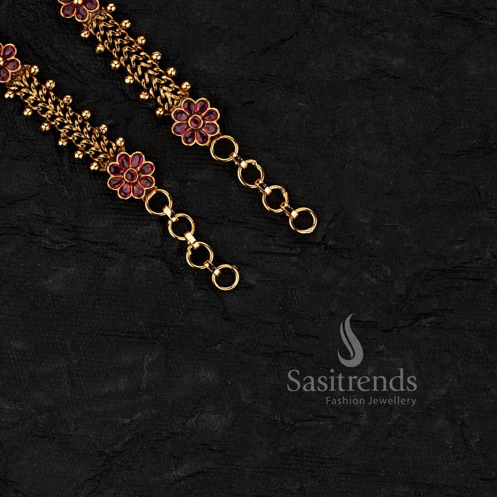 South indian style ear chains with floral patterns and layered chain structure crafted in matte gold plated finish for festive wear