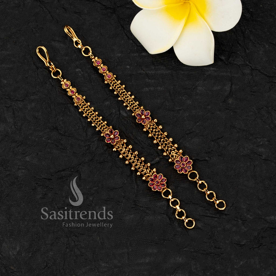 Temple matte gold plated ear chains with floral motifs and multi layer bead chains featuring intricate stone work for traditional styling