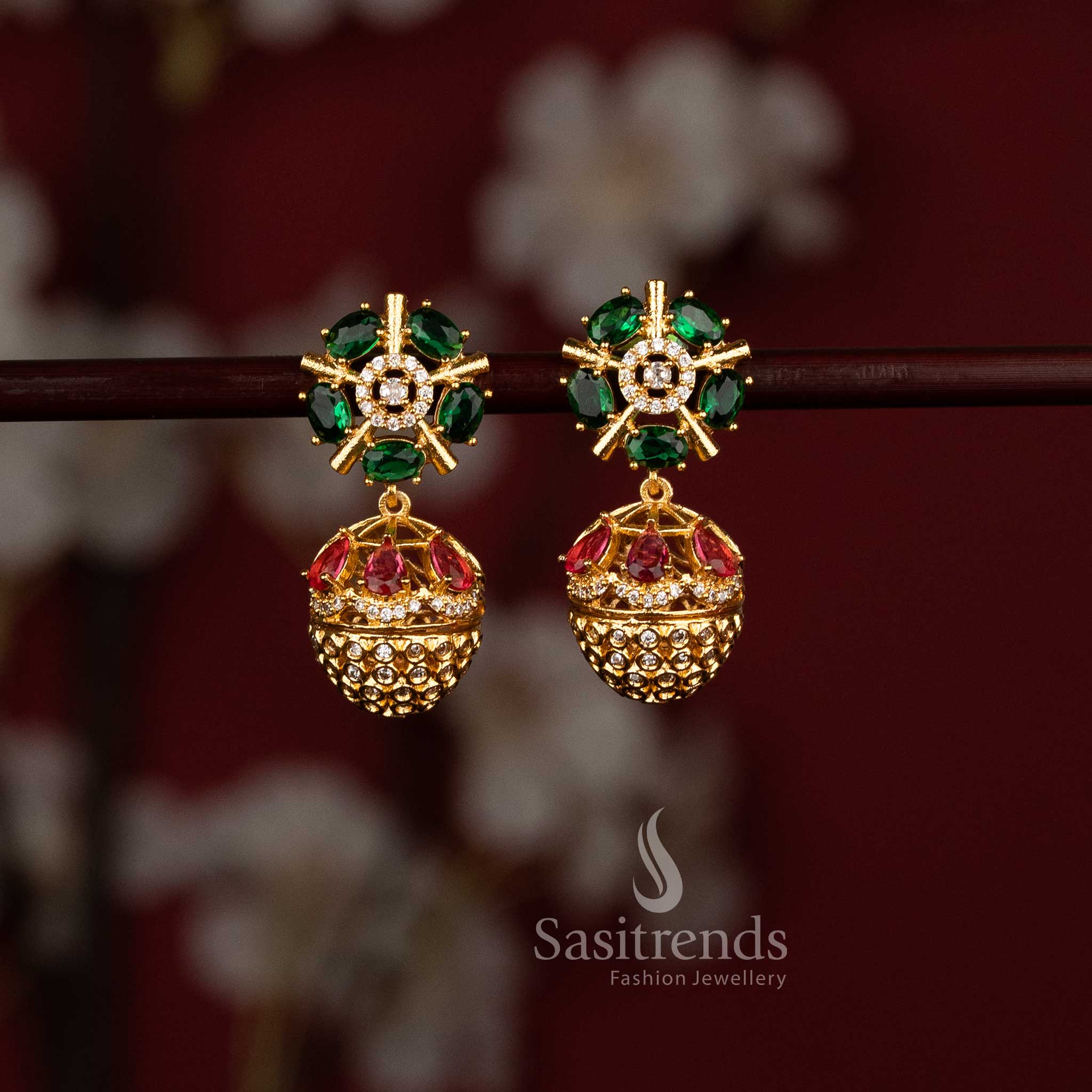 Sasitrends trendy red green American Diamond matte gold plated earrings with structured floral wheel motif and ornamental jhumka drop 