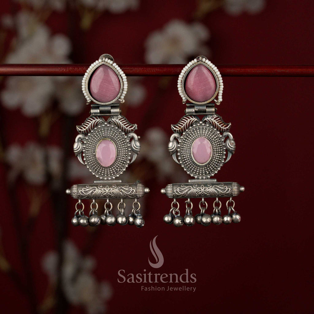 Sasitrends pink oxidised German silver tribal statement earrings featuring a stone stud, teardrop detailing, bird motif centerpiece and architectural rectangular frame, perfect for sarees and traditional kurtis.