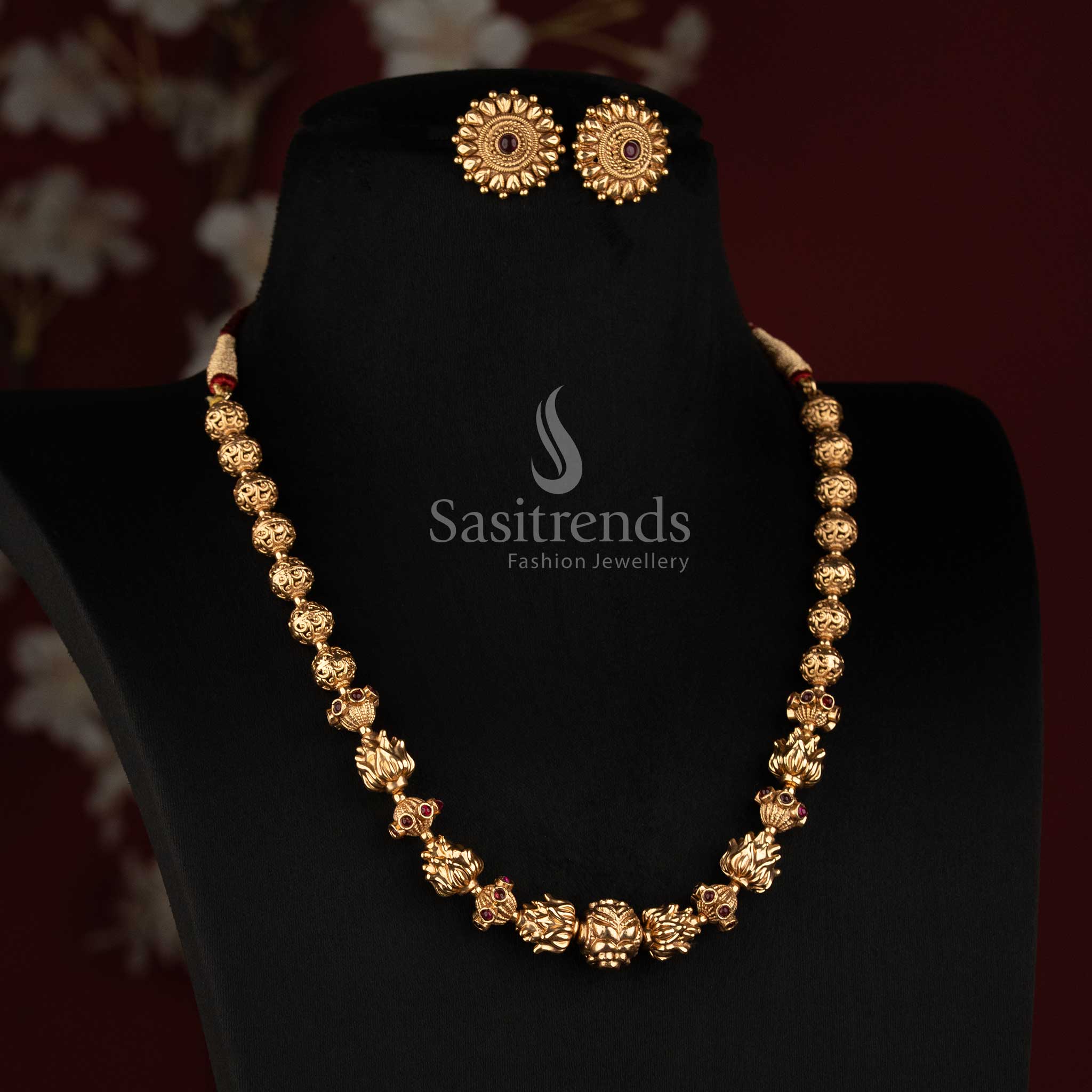Sasitrends antique gold plated temple jewellery necklace featuring detailed lotus floral motifs and stone work 