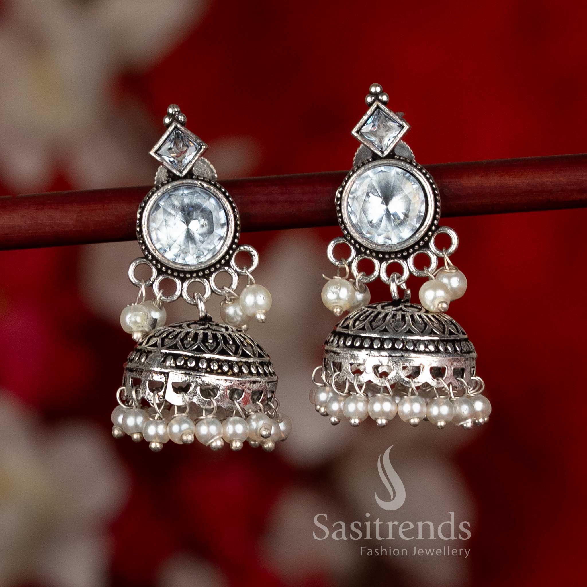 Sasitrends oxidised silver plated jhumka earrings showcasing circular stud design, layered dome structure, and pearl detailing in a white color variant, suitable for ethnic wear, office wear, casual wear, and contemporary saree looks
