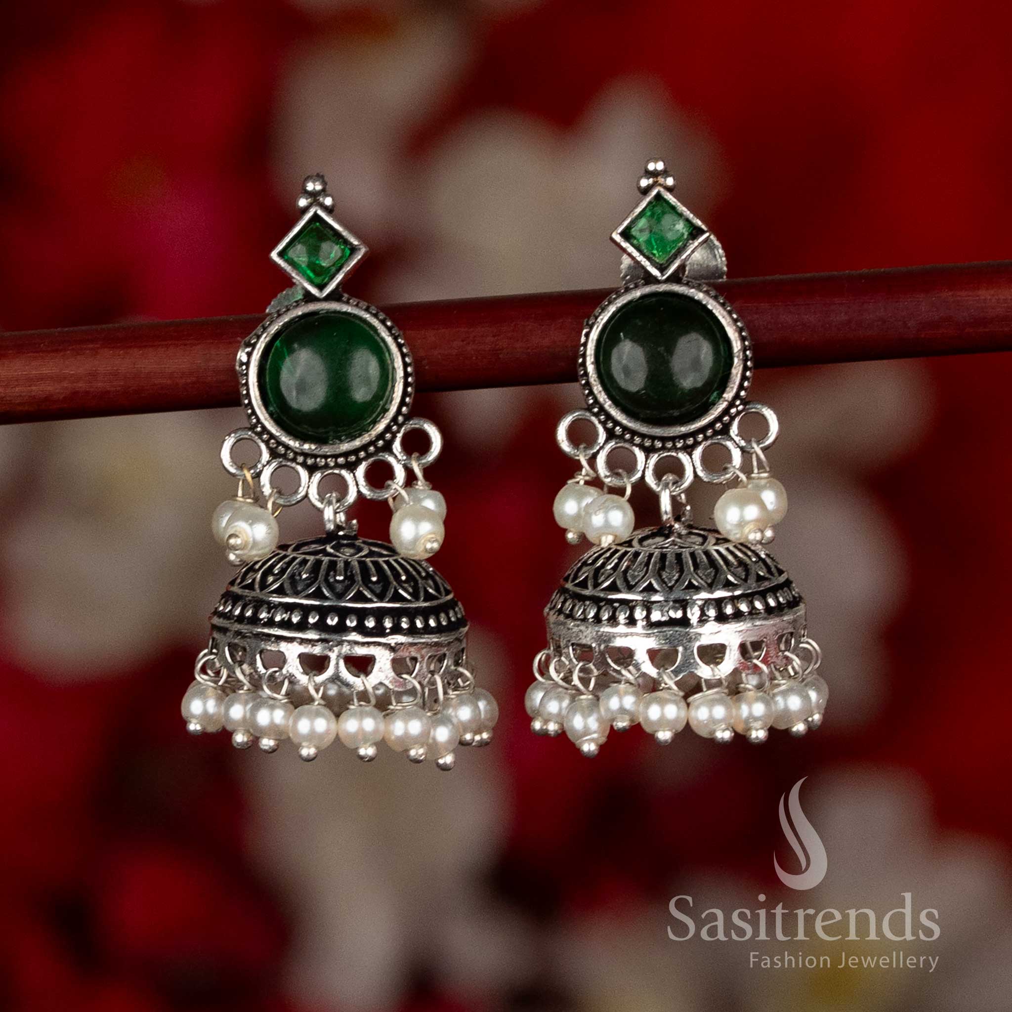 Oxidised silver plated jhumka earrings by Sasitrends designed with circular stud structure, detailed dome craftsmanship, and pearl hangings in a green color variant, ideal for ethnic wear, casual wear, office wear, and modern saree looks
