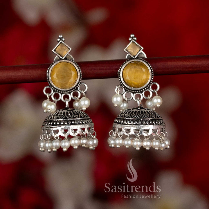Sasitrends oxidised silver plated jhumka earrings featuring circular stud design, engraved dome-shaped craftsmanship, and pearl bead detailing in a yellow color variant, perfect for ethnic wear, casual wear, office wear, and modern saree styling
