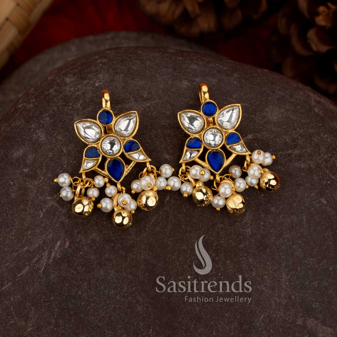
Sasitrends 24K jadau gold plated kundan floral leaf motif Bugadi earcuff earrings in white and blue stones with pearl hanging design inspired by classic Indian jewellery
