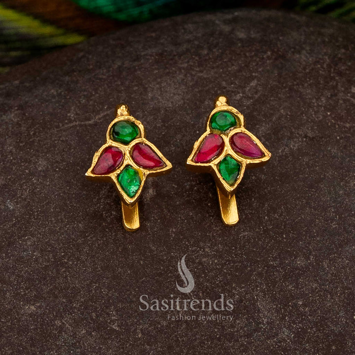 Sasitrends 24k jadau gold plated green ruby kundan stone bugadi earrings with intricate leaf motif design structure offering rich traditional elegance
