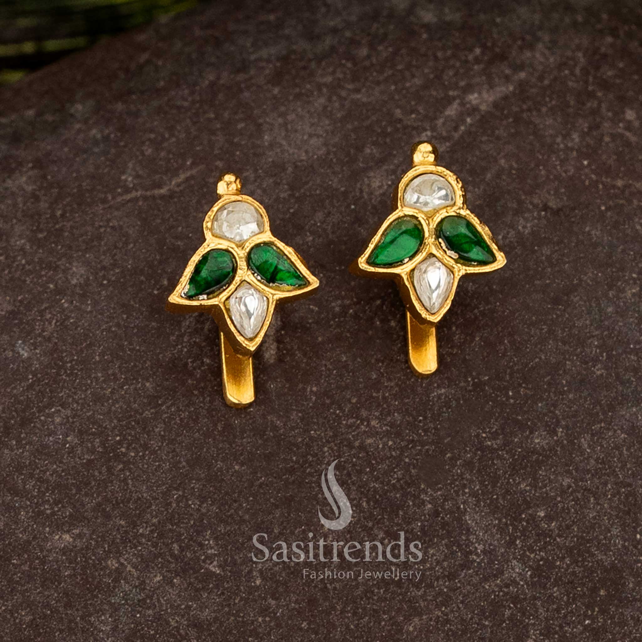 Sasitrends 24k jadau gold plated green and white kundan stone bugadi earrings featuring classic leaf motif design structure with rich traditional finish
