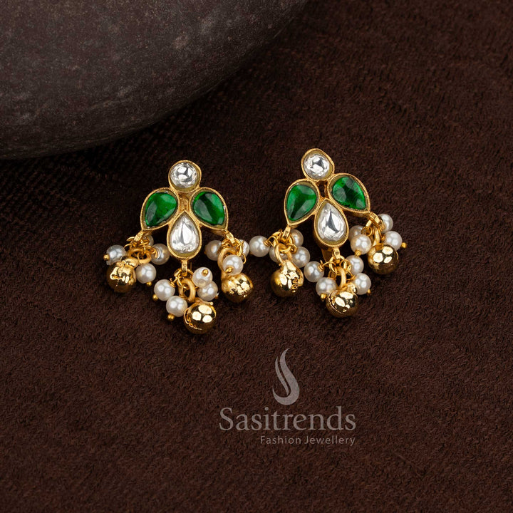 Sasitrends 24k jadau gold plated traditional white green kundan stone bugadi ear cuff earrings designed with leaf motif structure and pearl hanging accents creating a premium heritage look
