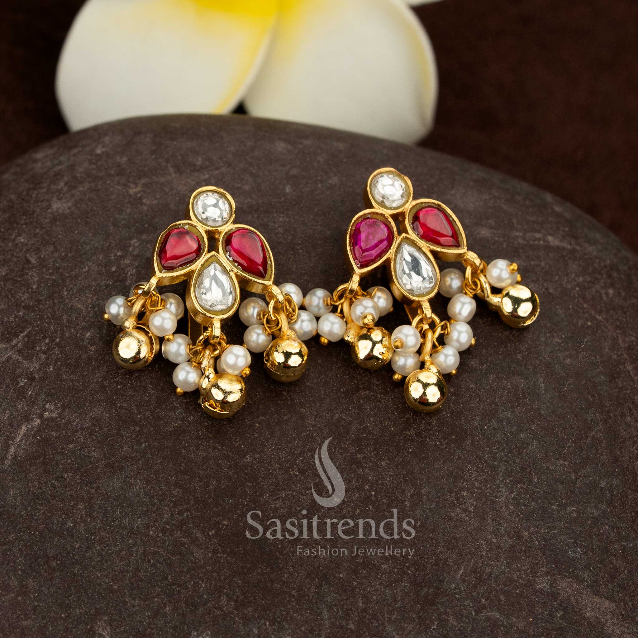 Sasitrends 24k jadau gold plated white ruby kundan stone bugadi ear cuff earrings featuring heritage floral and leaf design structure finished with pearl hanging beads for a rich traditional look
