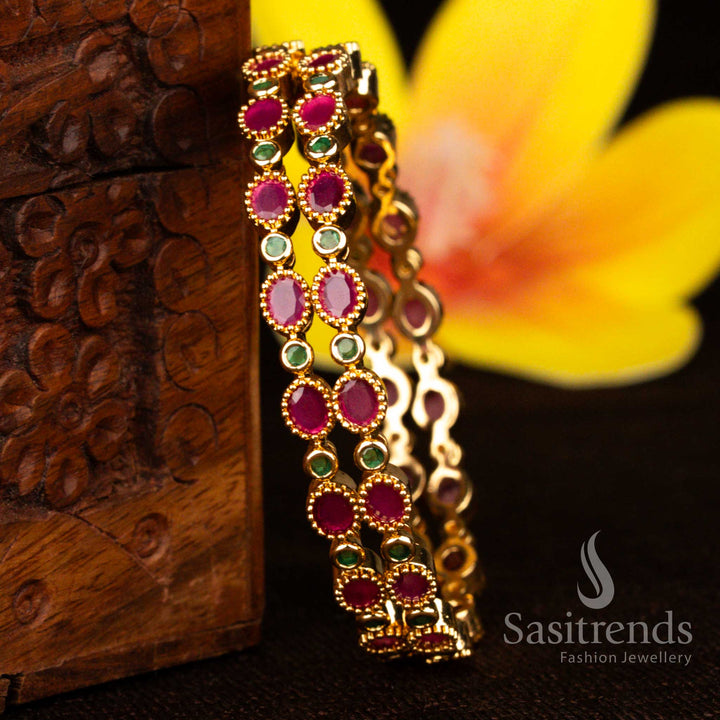 Sasitrends micro gold plated ruby green American diamond oval bezel link designer bangles with structured interlocking kada design and traditional detailed framework