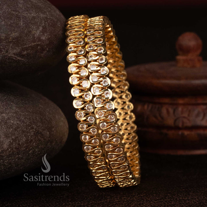 Sasitrends 24K micro gold plated impon S-curve bangle featuring round white AD stone detailing crafted for traditional attire and festive occasions