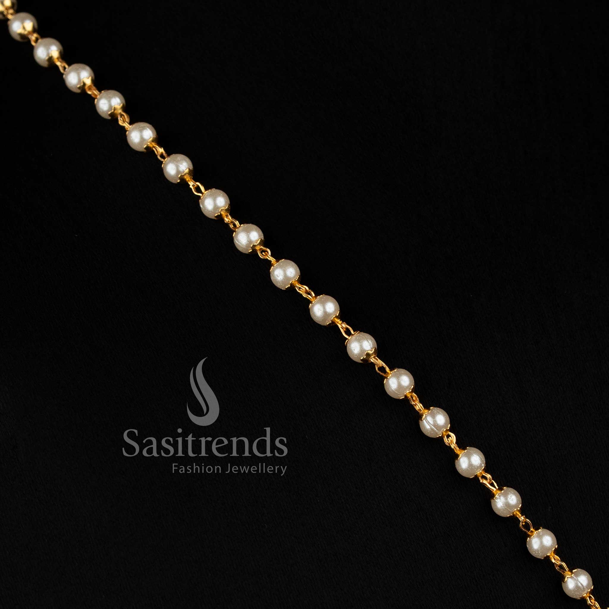 Elegant women’s long micro gold plated necklace with a slender beaded chain structure, detailed central floral pendant and AD stone embellishments for saree and festive styling