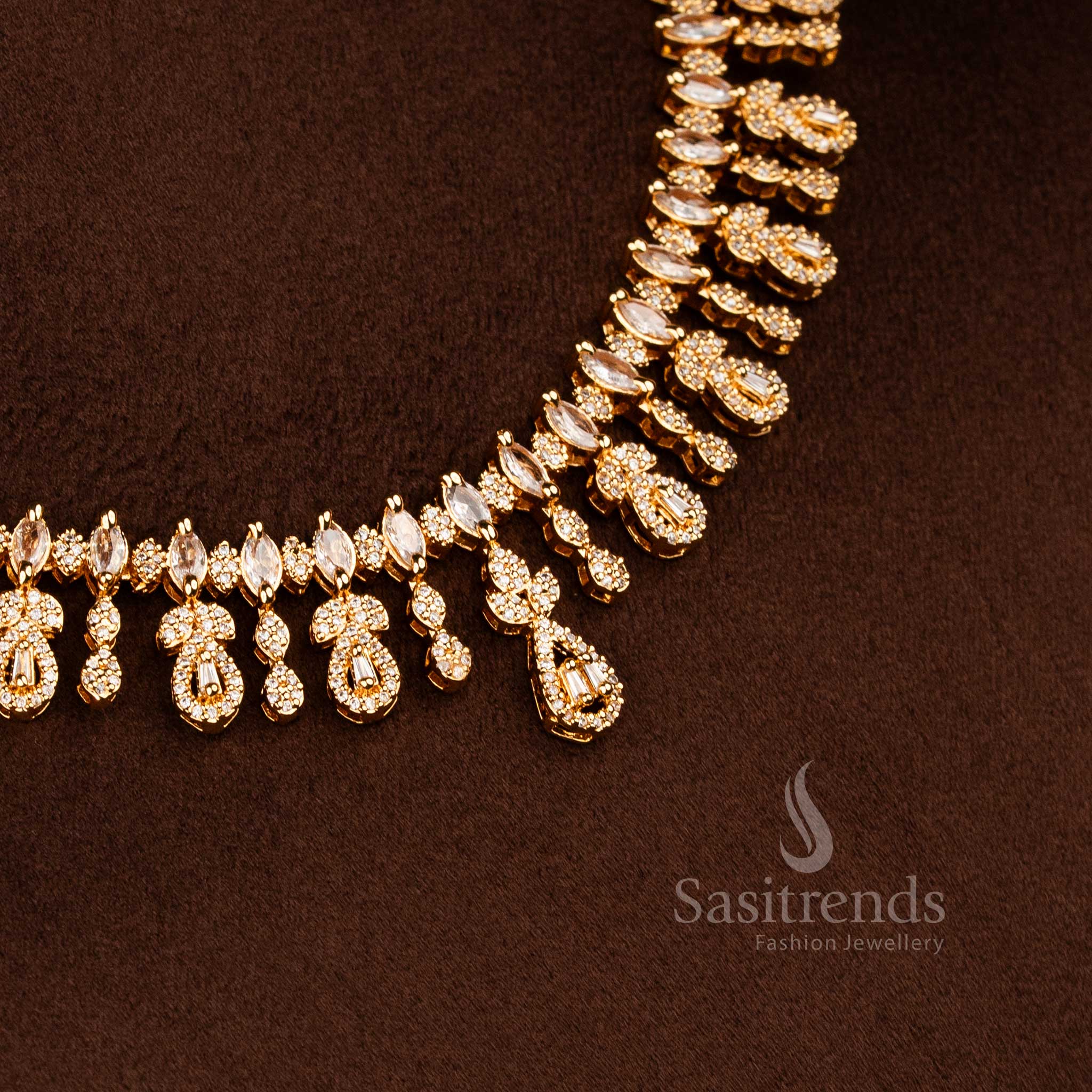 Sasitrends micro gold plated necklace set with pear-shaped white American diamond drop design, central elongated teardrop motif, and matching earrings bracelet ring