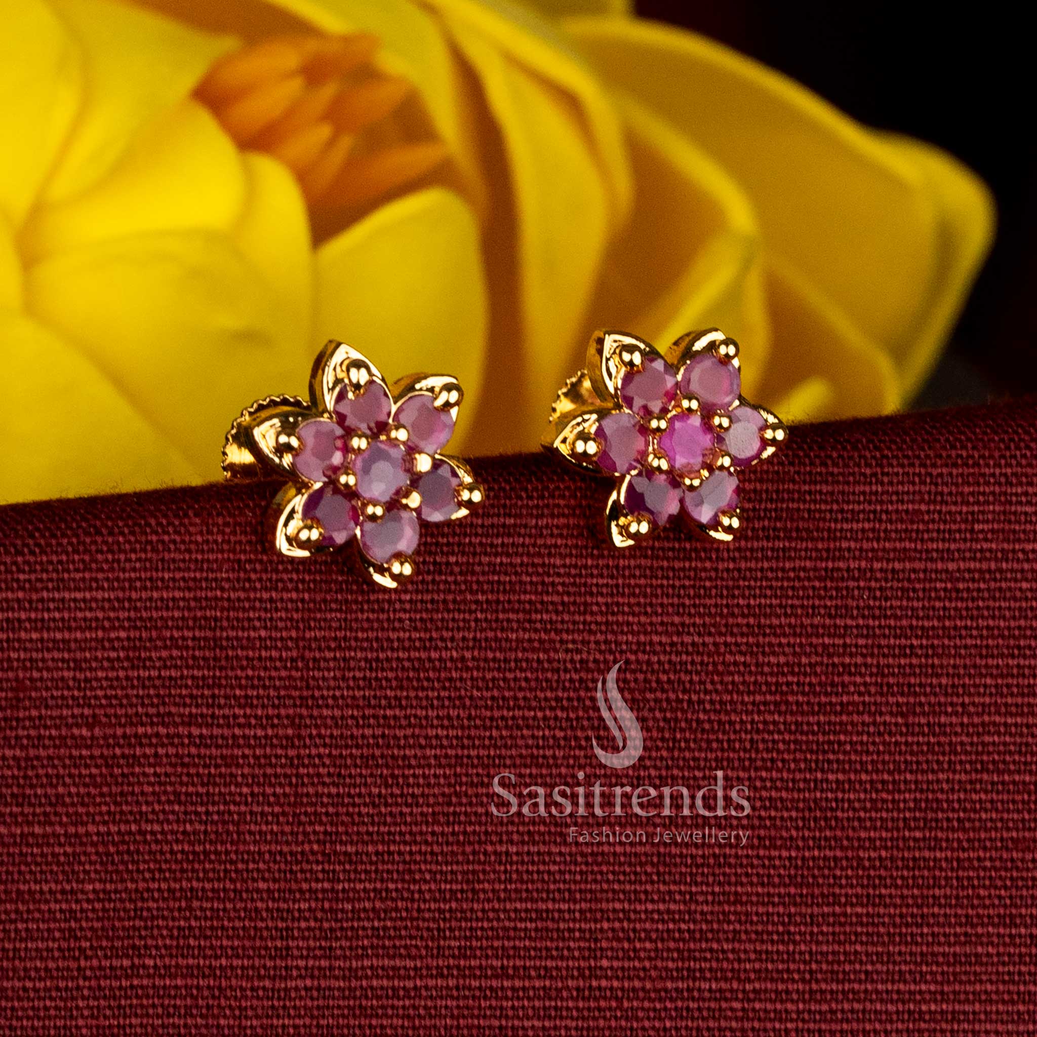 Sasitrends micro gold plated ruby AD stone floral stud earrings featuring detailed petal design and elegant craftsmanship