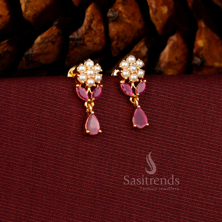 Sasitrends glorious micro gold plated pearl floral cluster dangler earrings featuring a sparkling teardrop ruby AD stone stud, premium 1 gram jewellery finish with a guaranteed real gold look for weddings and festive styling.