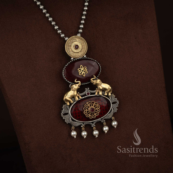 Sasitrends oxidised 92.5 silver plated necklace set featuring a bold vertical pendant layout with embossed medallion, floral Monalisa section, traditional elephant motifs, pearl danglers and oxidised silver beaded chain with earrings – red variant
