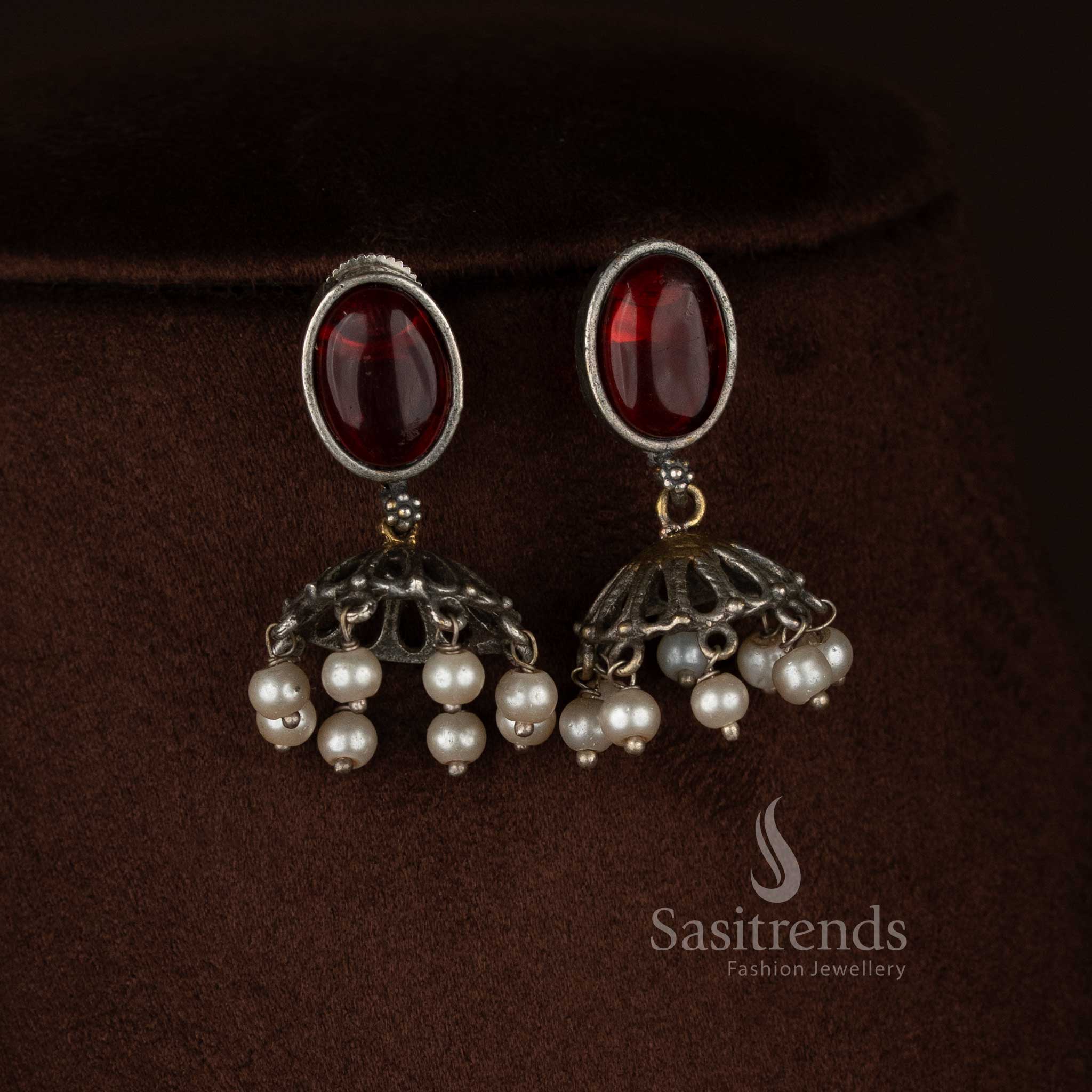 Sasitrends antique oxidised silver plated necklace jewellery set crafted with a vertical panel pendant design including embossed silver medallion, floral red Monalisa detailing, elephant motifs, pearl drop finish and matching earrings 
