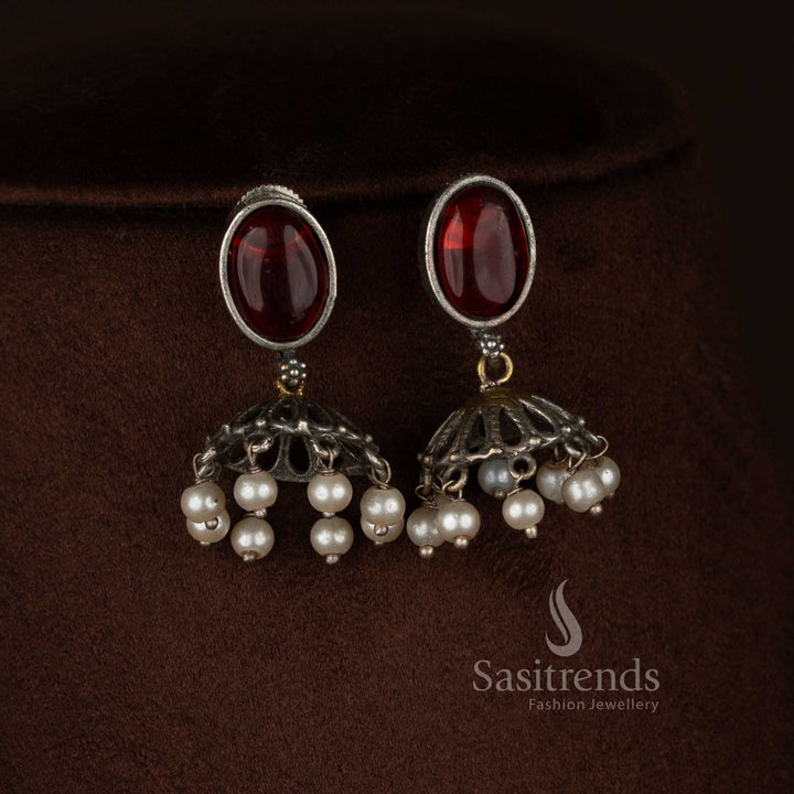 Sasitrends antique oxidised silver plated necklace jewellery set crafted with a vertical panel pendant design including embossed silver medallion, floral red Monalisa detailing, elephant motifs, pearl drop finish and matching earrings 
