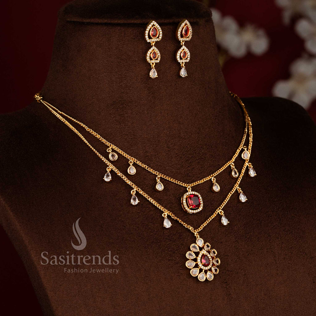 Micro gold plated two layer necklace set featuring teardrop white red American diamond danglers, floral pendant design, and matching drop earrings by Sasitrends