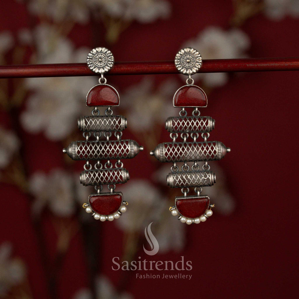Sasitrends antique red oxidised silver plated statement earrings featuring a multi-layered barrel structure with textured cylindrical detailing, highlighted stone panels and an elegant pearl drop finish for bold ethnic styling.