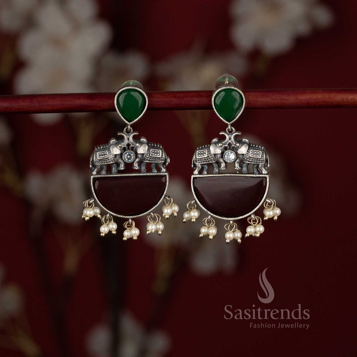 Sasitrends antique oxidised statement green maroon stone earrings featuring sculpted elephant motifs and structured half-moon base