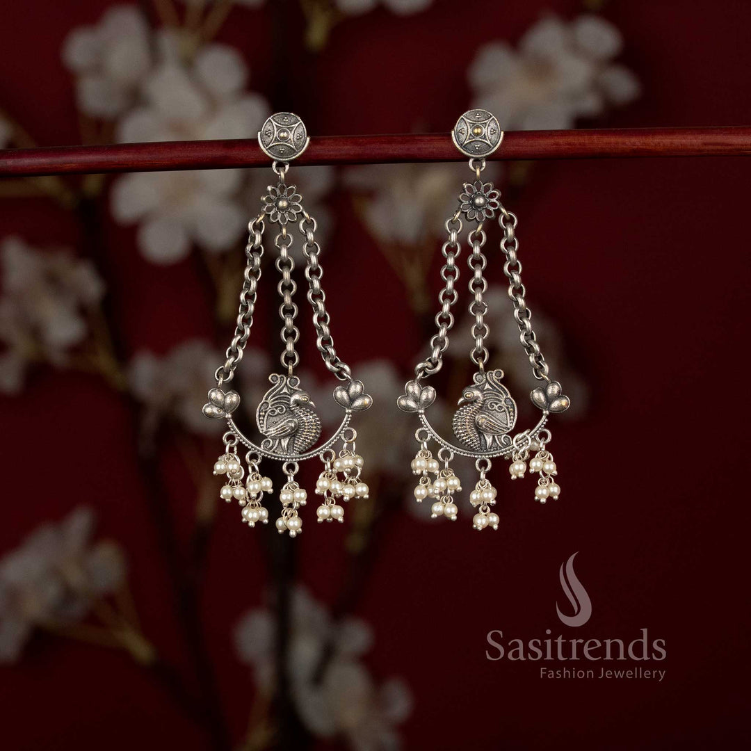 Sasitrends antique oxidised peacock motif chain drop earrings with floral stud design and pearl hangings