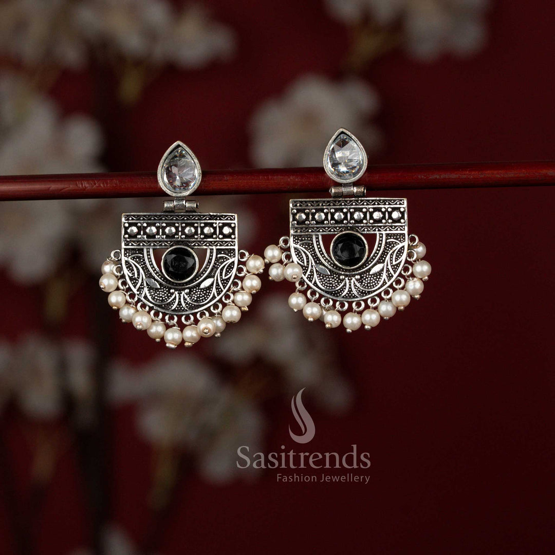 Sasitrends antique black oxidised silver chandbali earrings featuring a radiant pear-shaped stone set within a detailed crescent frame and finished with delicate pearl drops, ideal for sarees and festive ethnic occasions.