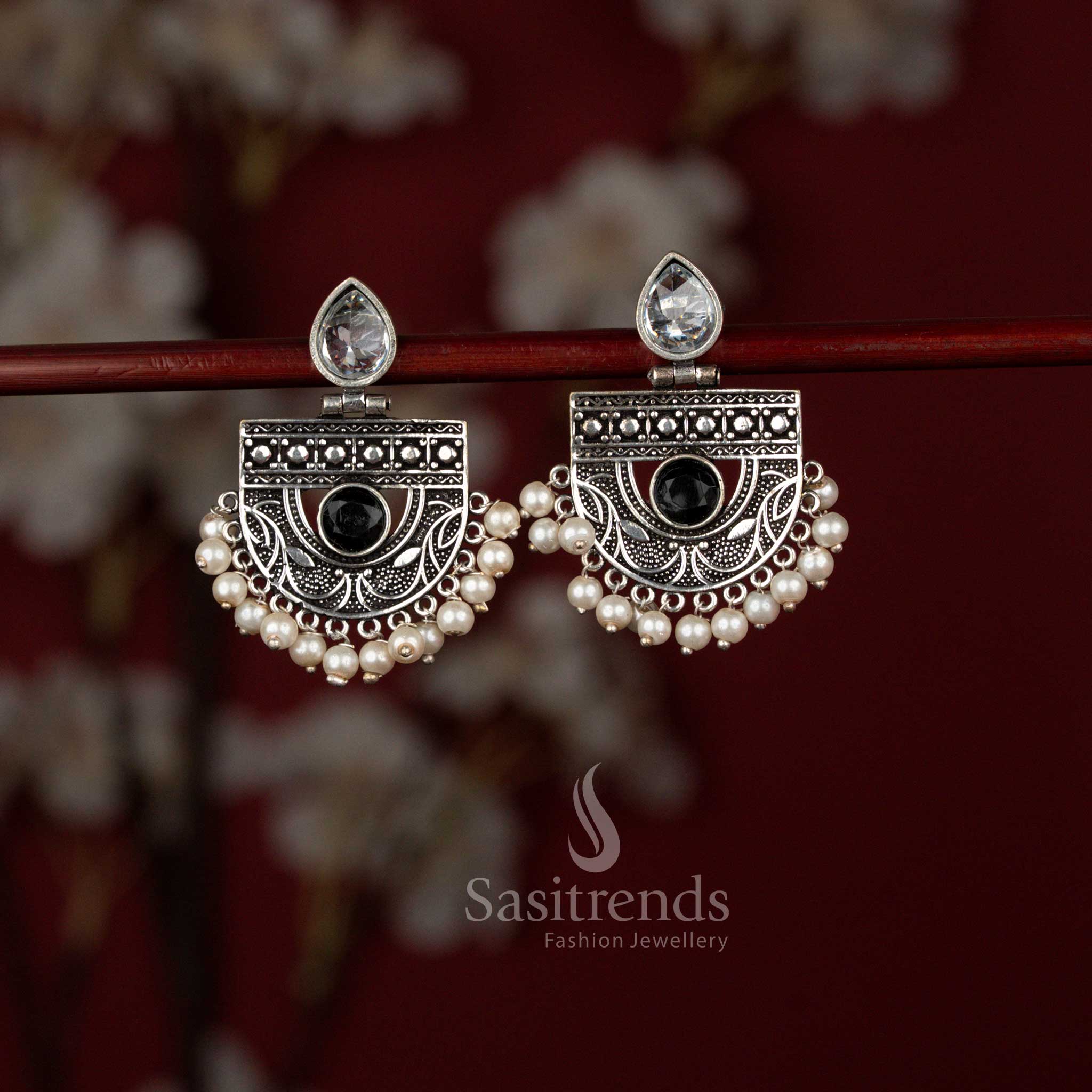 Sasitrends antique black oxidised silver chandbali earrings featuring a radiant pear-shaped stone set within a detailed crescent frame and finished with delicate pearl drops, ideal for sarees and festive ethnic occasions.