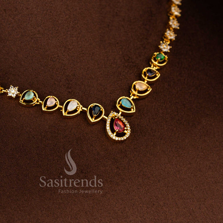 Sasitrends Navarathna American Diamond matte gold plated necklace set featuring symmetrical floral clusters and framed teardrop motif pendant for festive and office wear