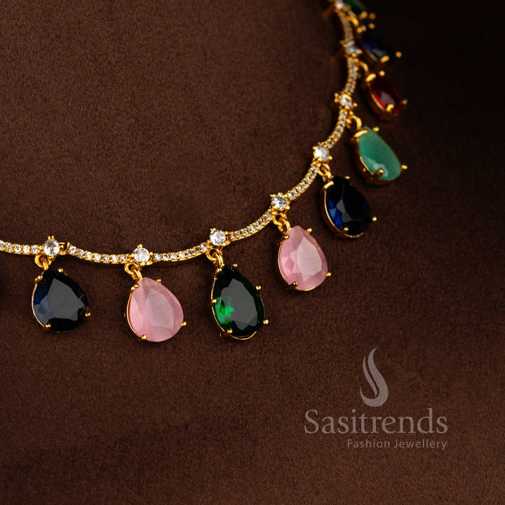 Sasitrends matte gold plated Navarathna American Diamond  stone necklace set featuring slim neckline structure with evenly spaced drop motifs and matching earrings
