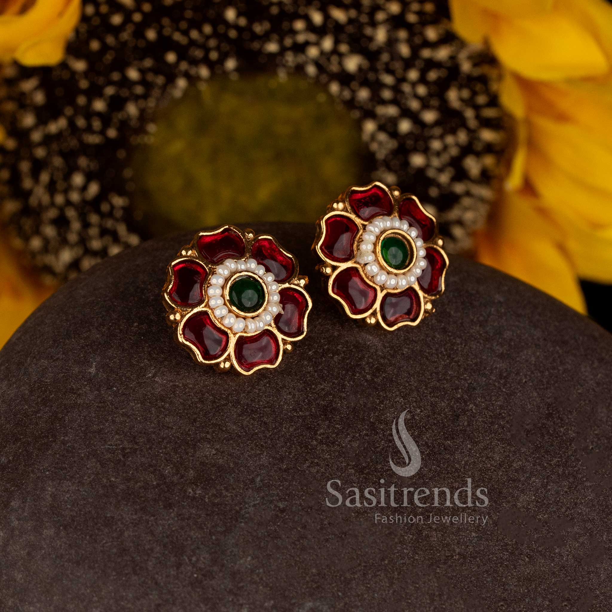 Sasitrends antique gold plated Indian floral earrings with raised petal motifs and intricate centre detailing 