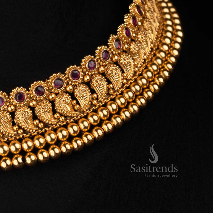 Sasitrends broad antique gold choker featuring continuous ornamental paisley motifs, detailed central stone settings and multiple rounded bead rows 