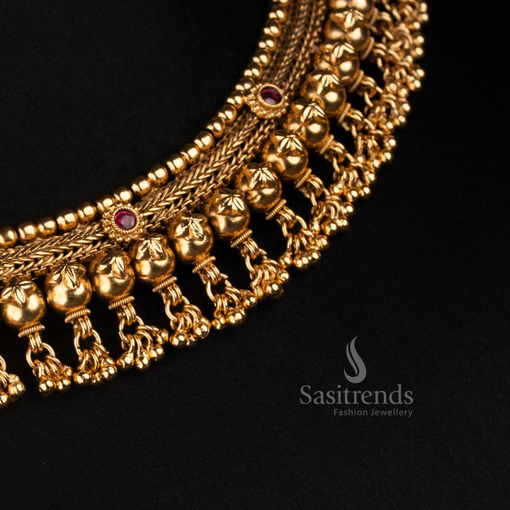 Sasitrends wide antique gold choker featuring continuous floral scrollwork, rounded bead borders and an elaborate fringe of hanging motifs