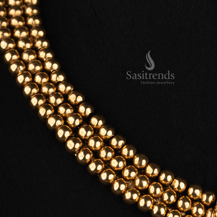 Sasitrends antique gold plated layered bead jewellery set with broad choker silhouette, floral-inspired pendant detailing and teardrop stone design 