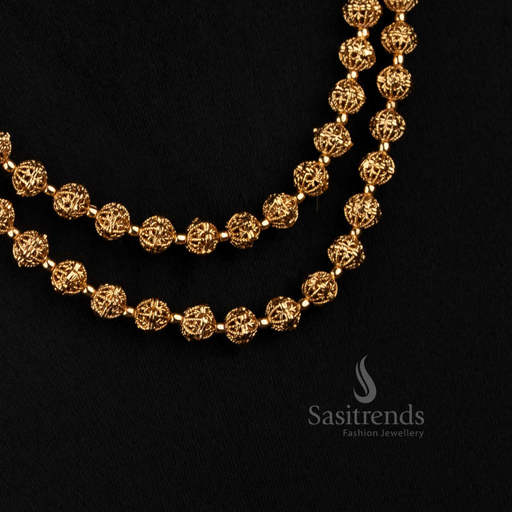 Sasitrends antique gold long necklace featuring two parallel strands of intricate floral beads with traditional jhumka-style earrings 