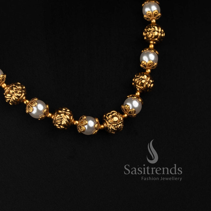 Sasitrends antique gold pearl necklace featuring repeated floral ornamental motifs, pearl beads and detailed round earrings 