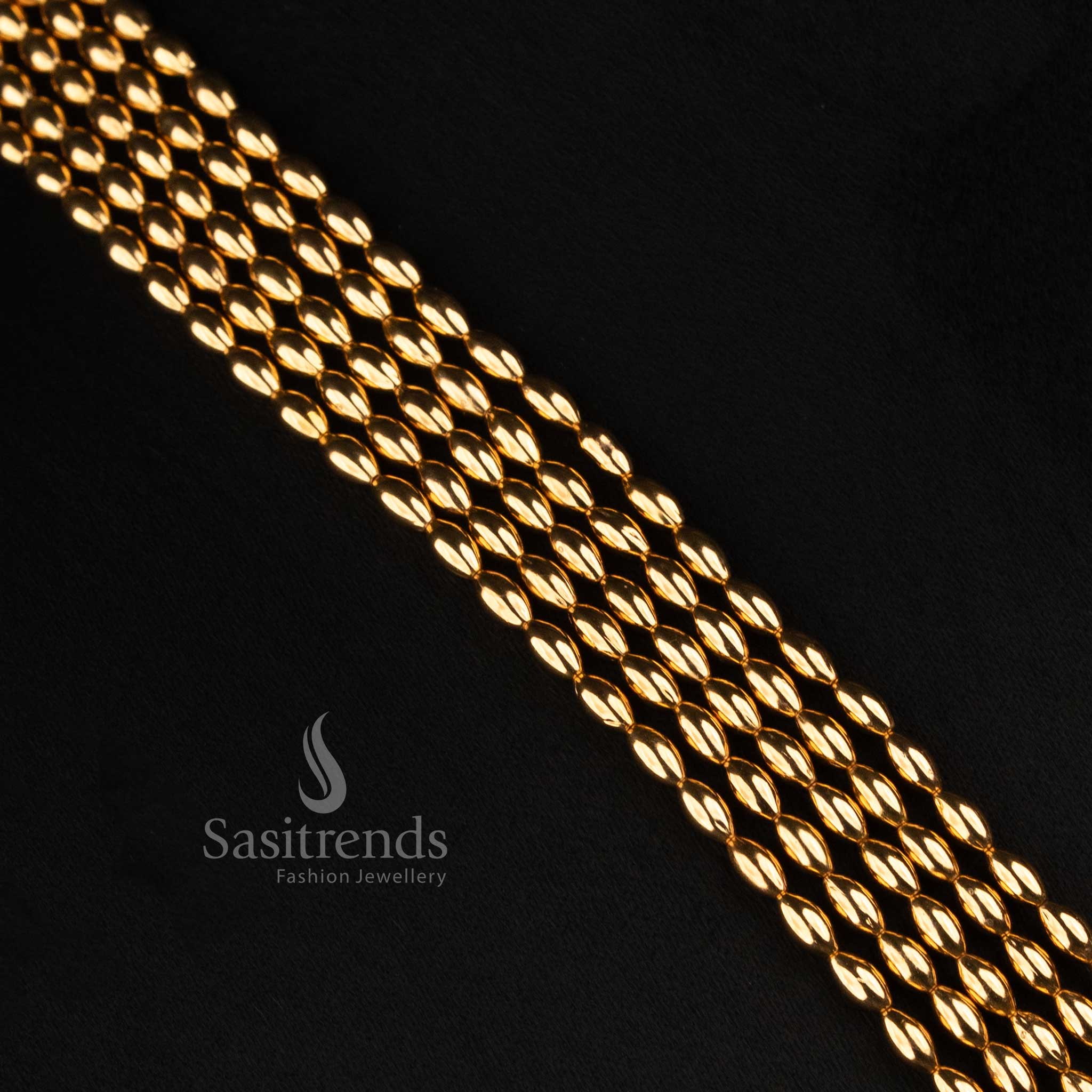 Sasitrends antique gold traditional five row necklace jewellery set with elongated layered bead structure and circular top jhumka earrings 