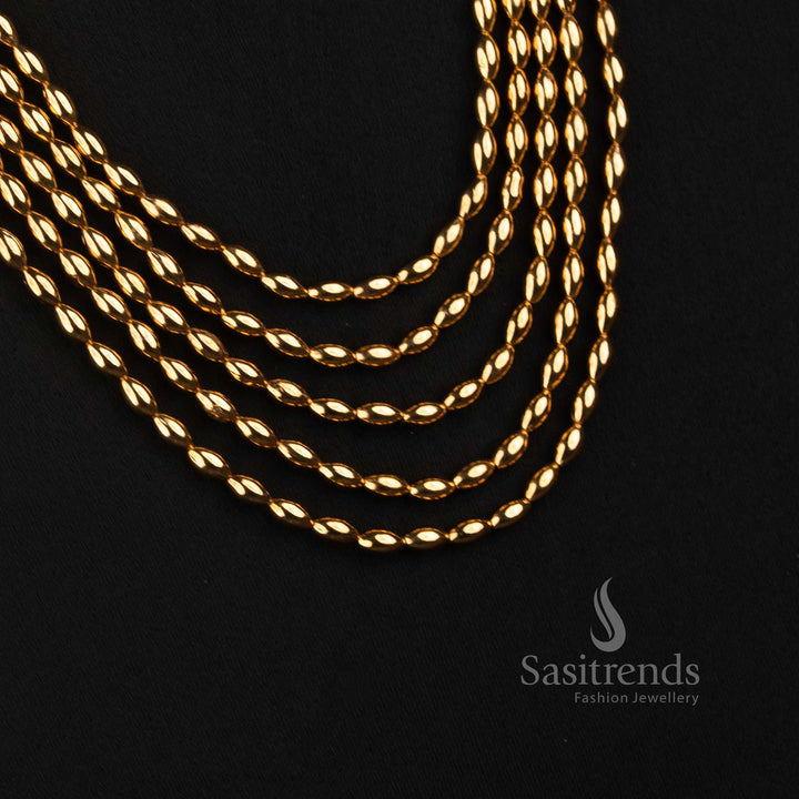 Sasitrends traditional long layered necklace featuring five flowing rows of rounded linked beads with detailed ornamental jhumka earrings 