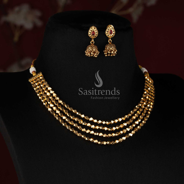 Sasitrends antique gold layered jewellery set with cascading diamond-shaped bead rows, teardrop stone earrings and detailed hanging Jhumka design 