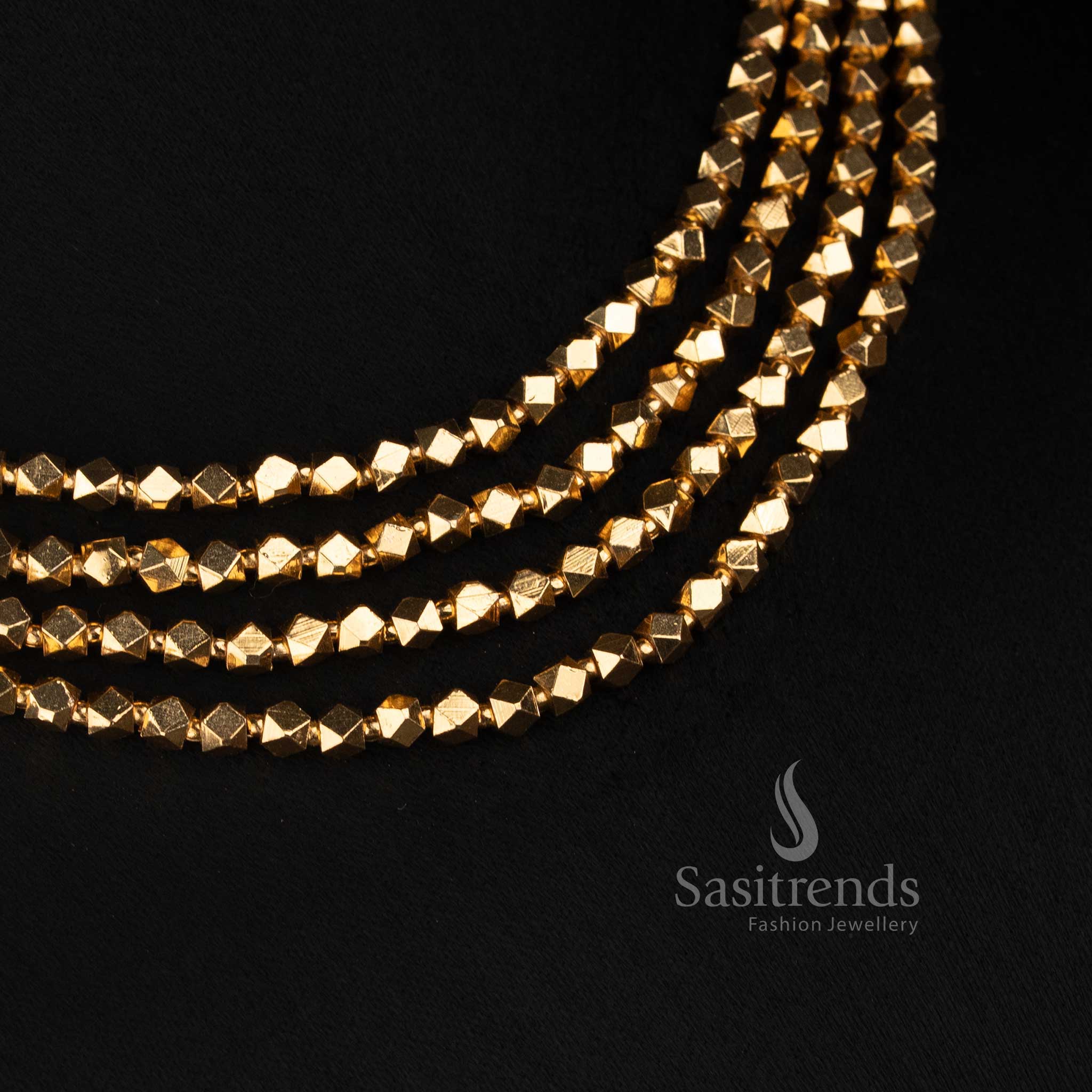 Sasitrends antique gold plated four-row diamond faceted bead necklace set with teardrop stone Jhumka earrings for traditional temple wear 