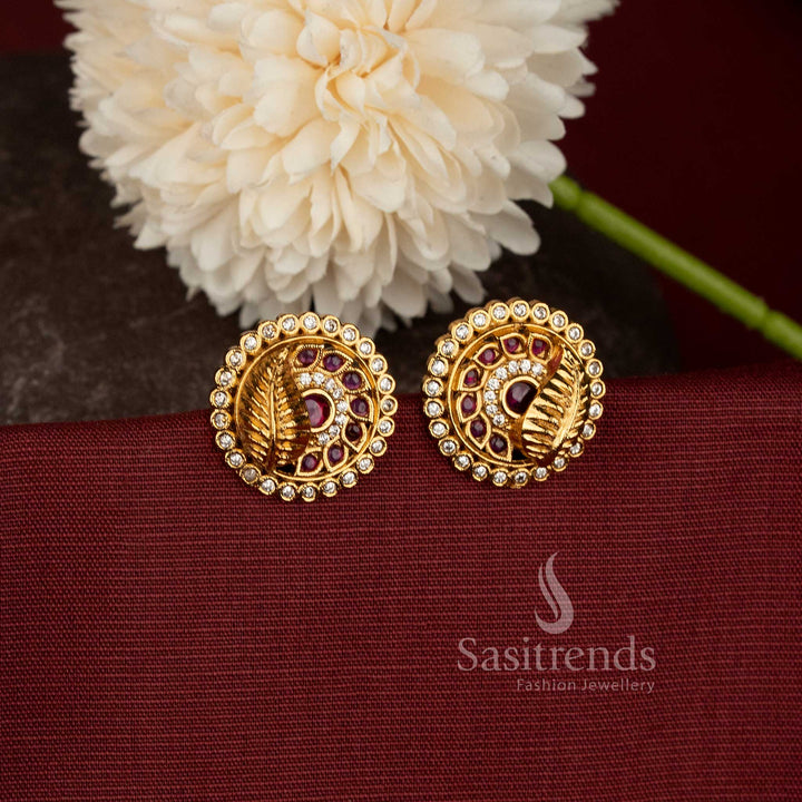 Traditional Temple Matte Gold Plated Peacock Feather Motif Circular Stud Earrings with AD Stone Borders - Sasitrends