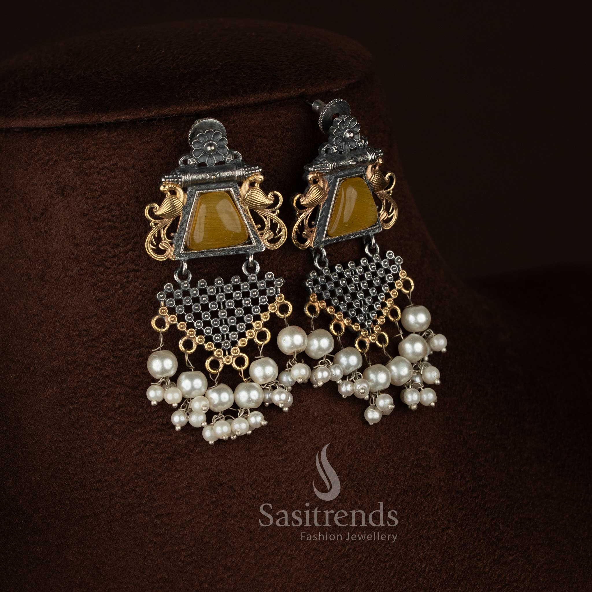 Sasitrends 92.5 silver plated antique oxidised necklace set designed with a detailed floral framework surrounding a peacock motif pendant, highlighted Monalisa stone setting, delicate pearl accents, textured oxidised finish, matching earrings, and traditional ethnic jewellery aesthetics.