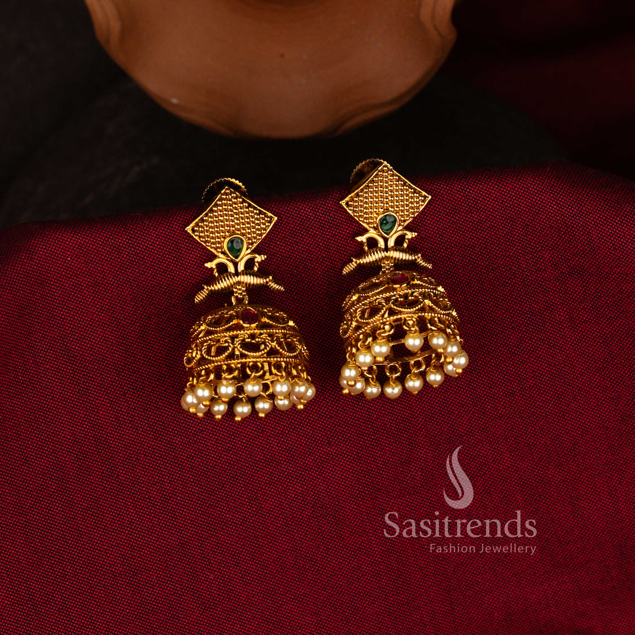 Sasitrends Filigree temple matte gold plated textured square stud pearl jhumka earrings with green stone accent