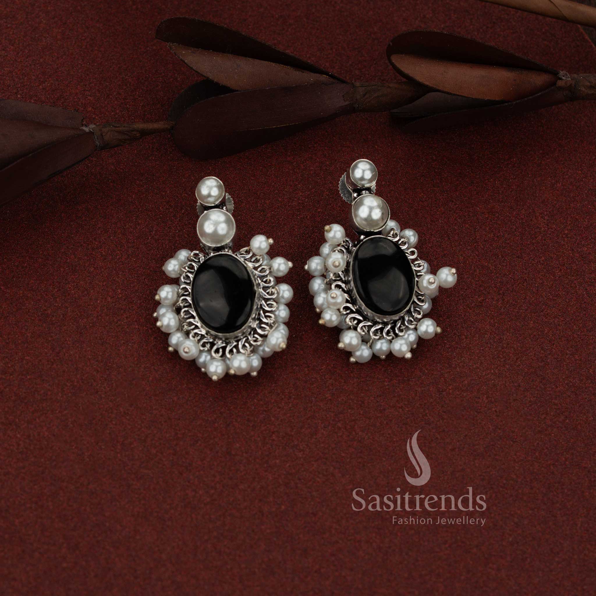 Sasitrends antique finish oxidised silver stud earrings designed with double pearl top and oval clustered black stone structure