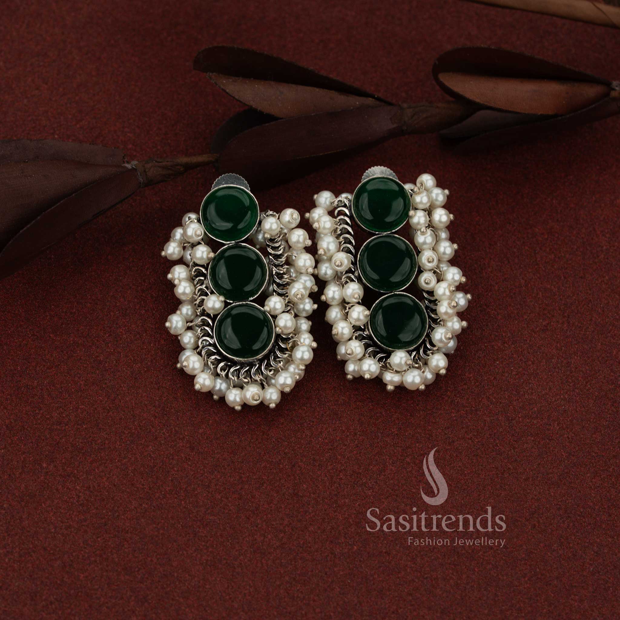Sasitrends antique finish oxidised silver green stud earrings designed with U-cut structure, triple stones and pearl accents